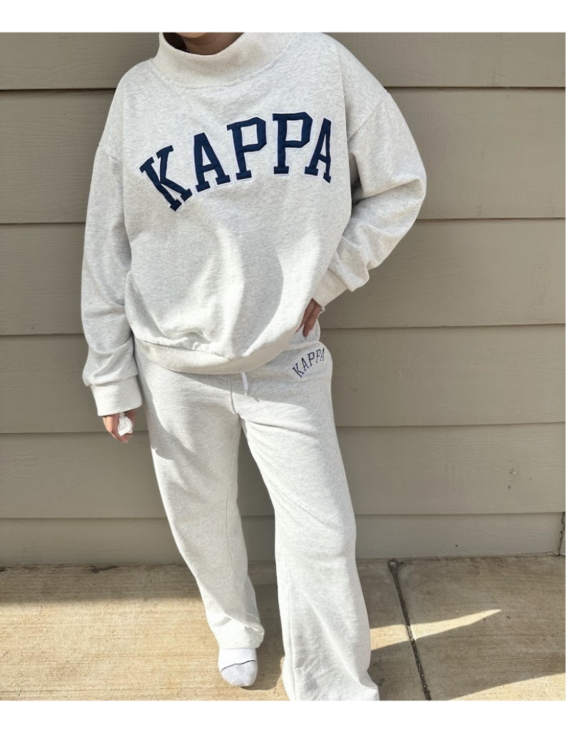 Model wearing Kappa sweatshirt and sweatpants set
